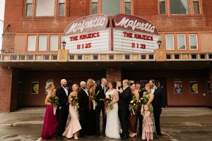 Wedding party in front of The Majestic Theater historic theater marquee