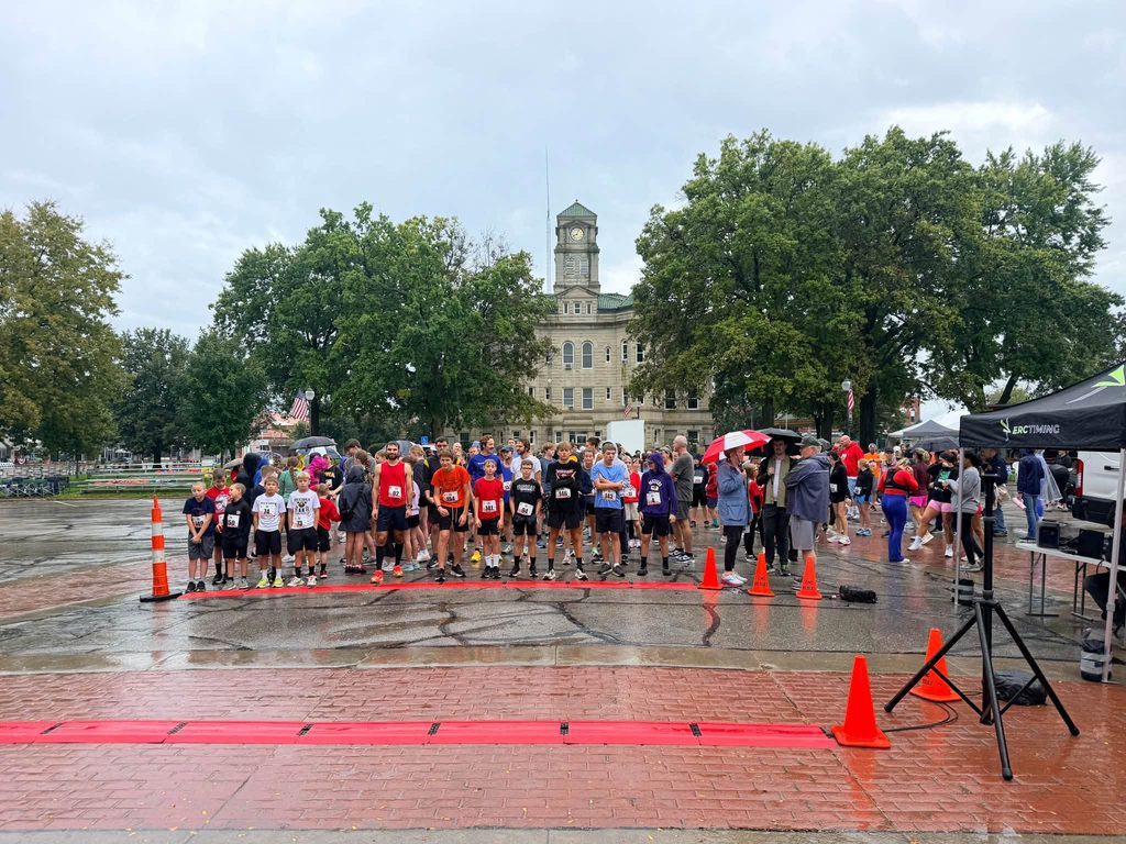 Fun run participants lined up in rain