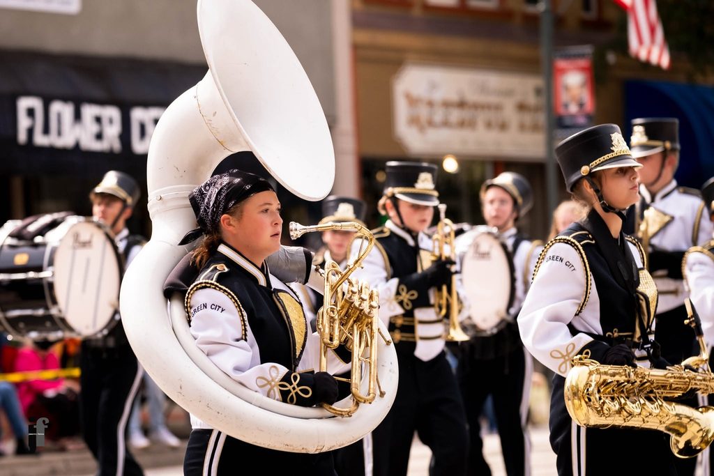 Students marching with band in 2026 Pancake Day parade